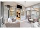 Cozy screened porch with comfortable seating and a ceiling fan at 1190 Mosspointe Dr, Roswell, GA 30075