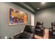 Home theater seating area with a large movie poster at 1190 Mosspointe Dr, Roswell, GA 30075