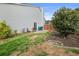 Large backyard showcasing a well-manicured lawn, mature trees, and a patio area at 2814 Pine Valley Nw Way, Kennesaw, GA 30152