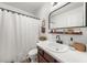 Well-lit bathroom featuring a framed mirror, and a shower and tub combination at 2814 Pine Valley Nw Way, Kennesaw, GA 30152