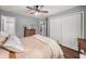 Bedroom with wood floors, natural light, and neutral walls featuring a spiral staircase view at 2814 Pine Valley Nw Way, Kennesaw, GA 30152