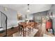 Bright dining area with hardwood floors and open access to the living room and kitchen at 2814 Pine Valley Nw Way, Kennesaw, GA 30152