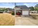 Charming home with a brick and vinyl exterior, well-manicured lawn, and an attached one-car garage at 2814 Pine Valley Nw Way, Kennesaw, GA 30152