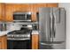 Close-up of stainless steel appliances and gas range stove top in the modern kitchen at 2814 Pine Valley Nw Way, Kennesaw, GA 30152
