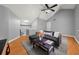 Comfortable living room showcasing vaulted ceilings, modern ceiling fan, and neutral color palette at 2814 Pine Valley Nw Way, Kennesaw, GA 30152