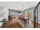 Open living area showcasing hardwood floors, a fireplace, and a seamless flow to the dining space at 2814 Pine Valley Nw Way, Kennesaw, GA 30152
