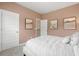Well-lit bedroom with a queen bed, neutral walls, and three framed art pieces at 321 Silver Leaf Trce, Douglasville, GA 30134
