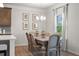 Cozy dining area with a wooden table and elegant chandelier lighting at 321 Silver Leaf Trce, Douglasville, GA 30134
