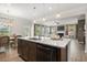 Bright kitchen with island, stainless appliances and view to open living area at 321 Silver Leaf Trce, Douglasville, GA 30134