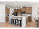 Spacious kitchen featuring a central island, modern appliances, and sleek finishes at 321 Silver Leaf Trce, Douglasville, GA 30134
