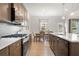 Modern kitchen featuring stainless steel appliances, granite countertops, and ample cabinet space at 321 Silver Leaf Trce, Douglasville, GA 30134
