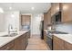 Well-equipped kitchen with stainless appliances, white countertops, and ample storage, showcasing functionality at 321 Silver Leaf Trce, Douglasville, GA 30134