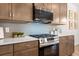 Modern kitchen features stainless steel range and microwave with sleek countertops at 321 Silver Leaf Trce, Douglasville, GA 30134
