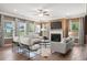Well-lit living room with a cozy fireplace, modern furniture, and large windows offering scenic views at 321 Silver Leaf Trce, Douglasville, GA 30134