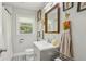 Charming bathroom with updated vanity and a window offering natural light at 952 Columbia Dr, Decatur, GA 30030