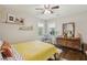 Cozy bedroom featuring a ceiling fan, hardwood floors, and natural light at 952 Columbia Dr, Decatur, GA 30030