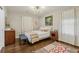 Cozy bedroom featuring hardwood floors, a neutral color palette and ample natural light at 952 Columbia Dr, Decatur, GA 30030