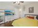 Bright bedroom with hard wood floors, a flat screen TV, and natural light at 952 Columbia Dr, Decatur, GA 30030