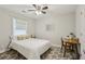 Cozy bedroom with a full size bed, desk, and a ceiling fan at 952 Columbia Dr, Decatur, GA 30030