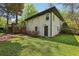 View of the home's exterior, landscaped yard, and stairs to the back deck at 952 Columbia Dr, Decatur, GA 30030