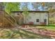 View of home's exterior featuring the back deck and stone accents at 952 Columbia Dr, Decatur, GA 30030