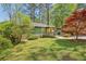 Well-maintained home with a lush green lawn and vibrant landscaping at 952 Columbia Dr, Decatur, GA 30030