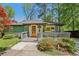 Charming home featuring an inviting front porch with a brightly colored door at 952 Columbia Dr, Decatur, GA 30030