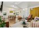 Spacious living room with hardwood floors, stylish furniture, and abundant natural light at 952 Columbia Dr, Decatur, GA 30030