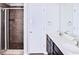 Modern bathroom features dual sinks, tile flooring, and a tiled shower with glass door at 1147 Laurel Valley Ct, Buford, GA 30519