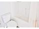 Bright bathroom features a toilet, bathtub, and shower curtain at 1147 Laurel Valley Ct, Buford, GA 30519