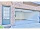 Attached garage with epoxy flooring and interior access door for added convenience at 1147 Laurel Valley Ct, Buford, GA 30519