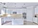 Modern kitchen with white cabinets, granite countertops, and stainless steel appliances at 1147 Laurel Valley Ct, Buford, GA 30519