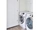 Bright laundry room features side-by-side washer and dryer at 1147 Laurel Valley Ct, Buford, GA 30519