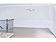 Living Room featuring beautiful wainscoting and light hardwood floors at 1147 Laurel Valley Ct, Buford, GA 30519