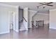 Bright living room featuring hardwood floors, stairs, and plenty of natural light at 1147 Laurel Valley Ct, Buford, GA 30519