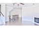 Bright living room featuring hardwood floors, a fireplace, and staircase at 1147 Laurel Valley Ct, Buford, GA 30519