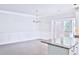 Open floor plan shows living and dining area with hardwood floors at 1147 Laurel Valley Ct, Buford, GA 30519