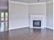 Elegant living room with hardwood floors and a cozy fireplace at 1147 Laurel Valley Ct, Buford, GA 30519