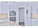 Kitchen boasts an open pantry with plentiful shelving and food storage space at 1147 Laurel Valley Ct, Buford, GA 30519