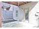 Covered patio with access to the house, a window and fenced border at 1147 Laurel Valley Ct, Buford, GA 30519