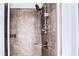 Modern shower with tile surround and adjustable shower head at 1147 Laurel Valley Ct, Buford, GA 30519