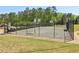 Community basketball court is fenced and ready for a pick-up game at 2130 Hollowbrooke Nw Way, Acworth, GA 30101