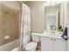 Charming bathroom featuring a shower-tub combo, a toilet, and a single sink vanity at 2130 Hollowbrooke Nw Way, Acworth, GA 30101