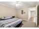 Comfortable bedroom featuring neutral paint, carpet flooring, and a door to the basement at 2130 Hollowbrooke Nw Way, Acworth, GA 30101