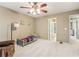Inviting bedroom with a ceiling fan, a twin bed, and a doorway to another room at 2130 Hollowbrooke Nw Way, Acworth, GA 30101