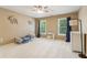 Bright bedroom with two large windows, a ceiling fan, and neutral walls at 2130 Hollowbrooke Nw Way, Acworth, GA 30101