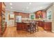 Features a kitchen with cherry cabinets, granite countertops, an island, and stainless steel appliances at 2130 Hollowbrooke Nw Way, Acworth, GA 30101