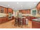 Features a kitchen with cherry cabinets, granite countertops, an island, and stainless steel appliances at 2130 Hollowbrooke Nw Way, Acworth, GA 30101