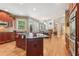 Features a kitchen with cherry cabinets, granite countertops, and stainless steel appliances with natural lighting at 2130 Hollowbrooke Nw Way, Acworth, GA 30101