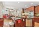 Features a kitchen with cherry cabinets, granite countertops, and stainless steel appliances with an island sink at 2130 Hollowbrooke Nw Way, Acworth, GA 30101